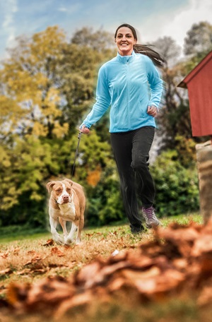 Jess Maciey running with her dog